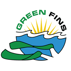 Circular logo showing yellow sun rays above blue stylized waves, green scuba fins in the foreground and the words "GREEN FINS" curved at the top